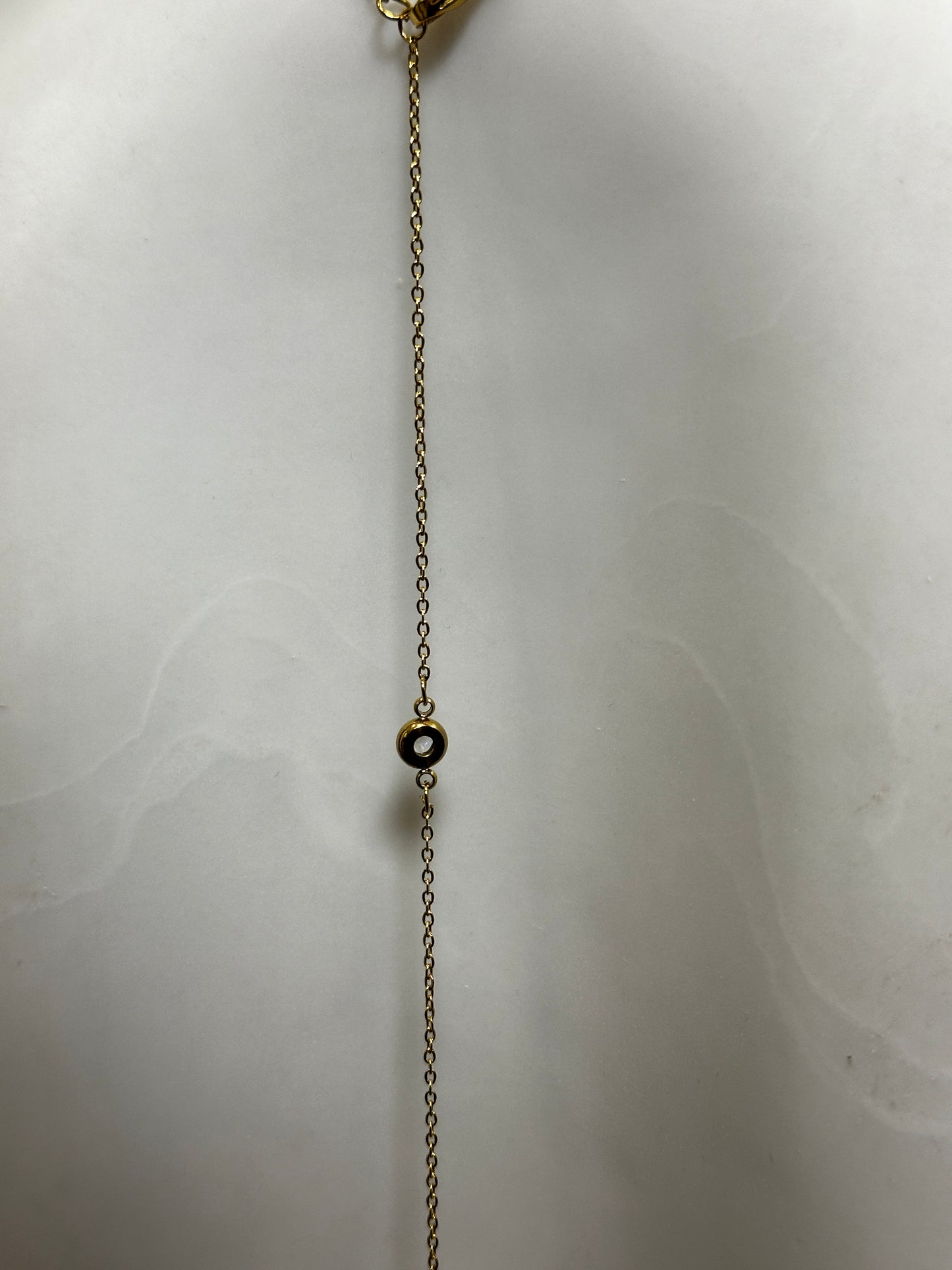 Chain necklace with rhinestones on the back