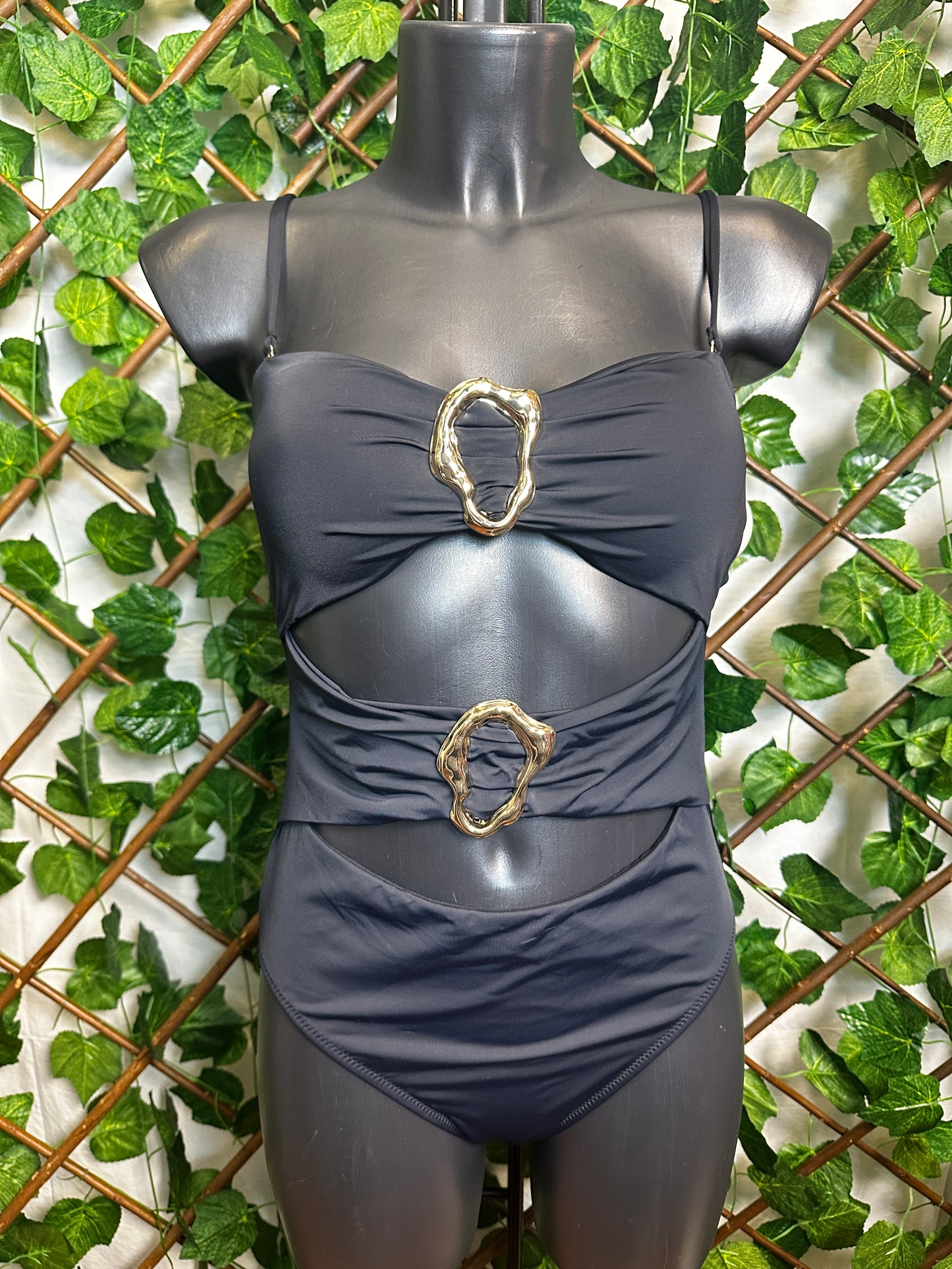 One-piece swimsuit with golden circle detail