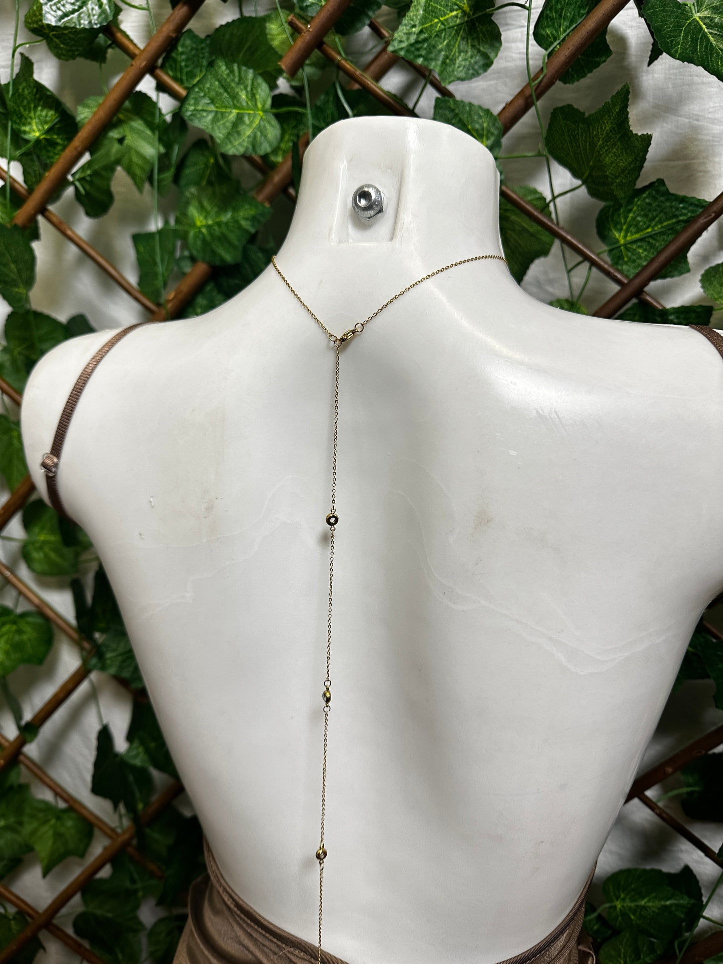 Chain necklace with rhinestones on the back