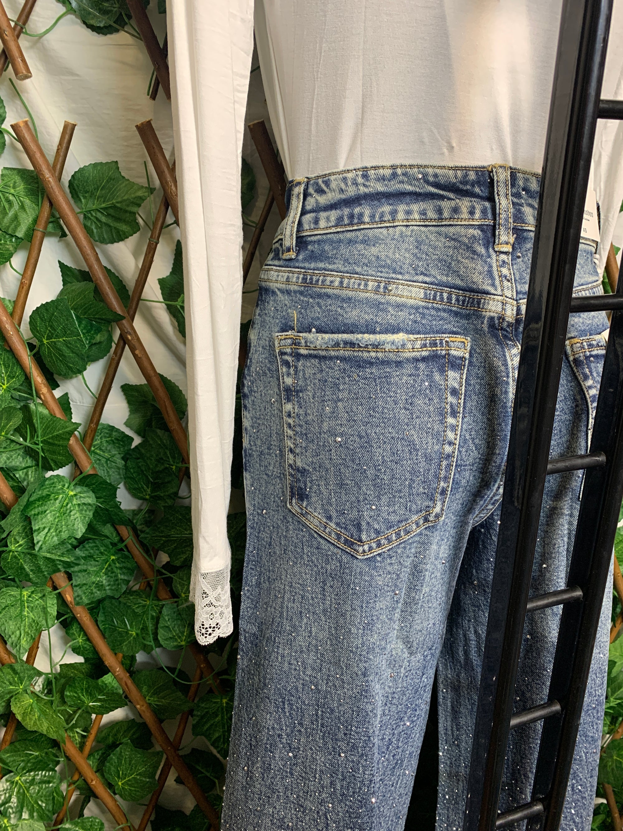 Jeans brillanti con piega