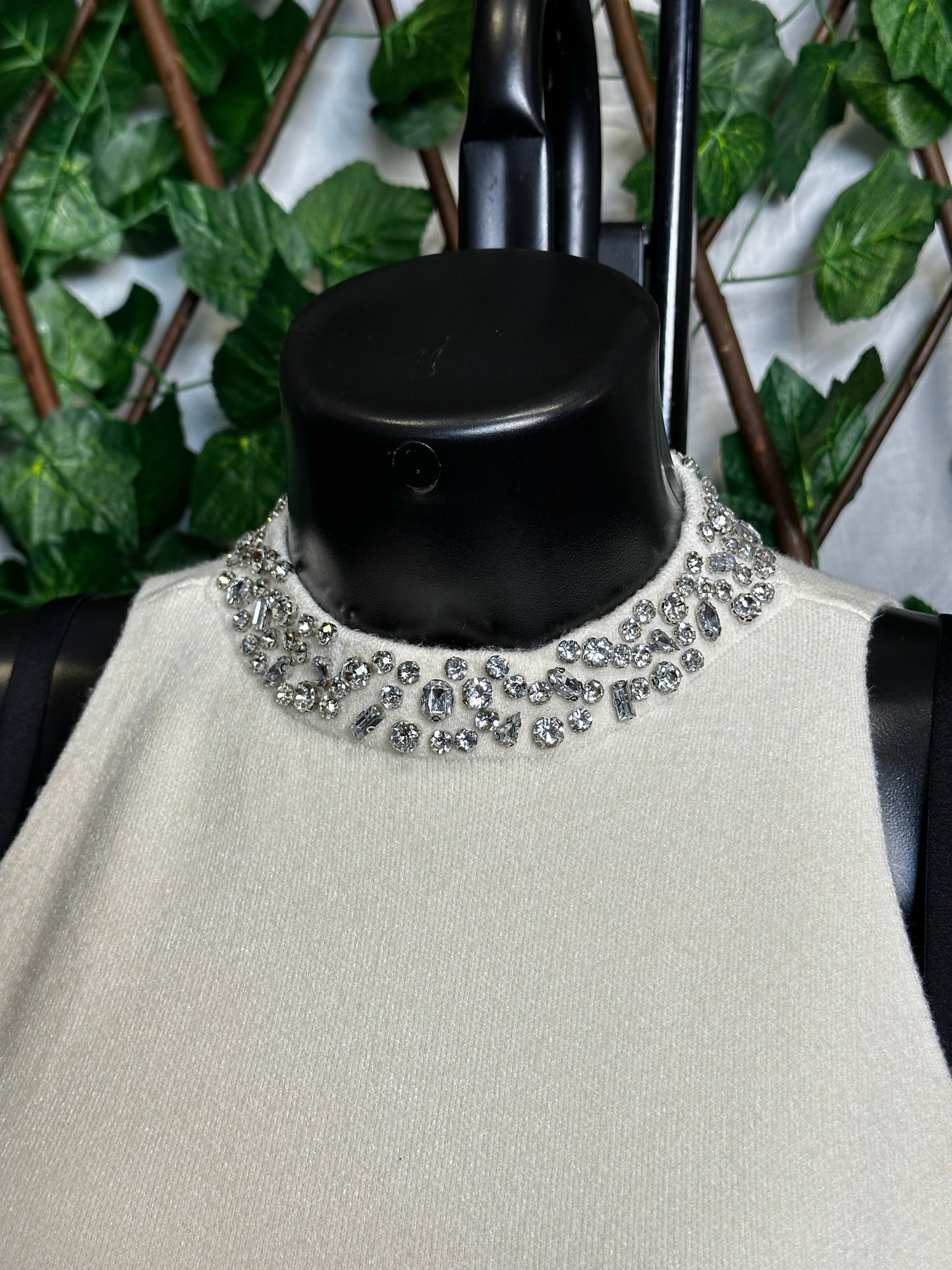 Maglione lungo senza maniche con collo brillantinato