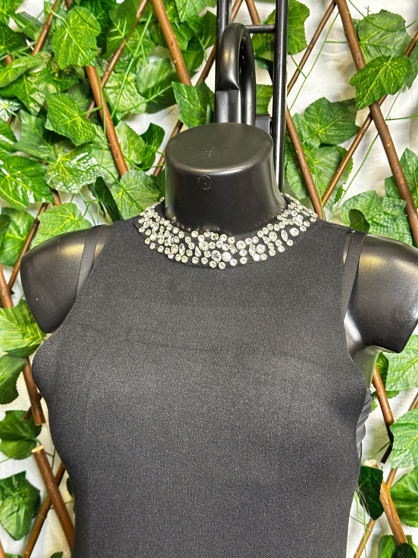 Maglione lungo senza maniche con collo brillantinato