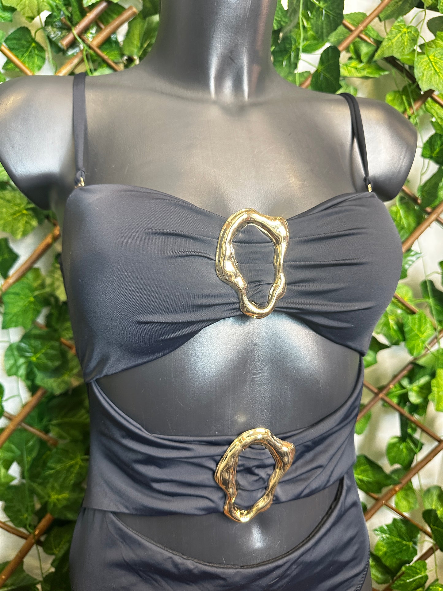 One-piece swimsuit with golden circle detail
