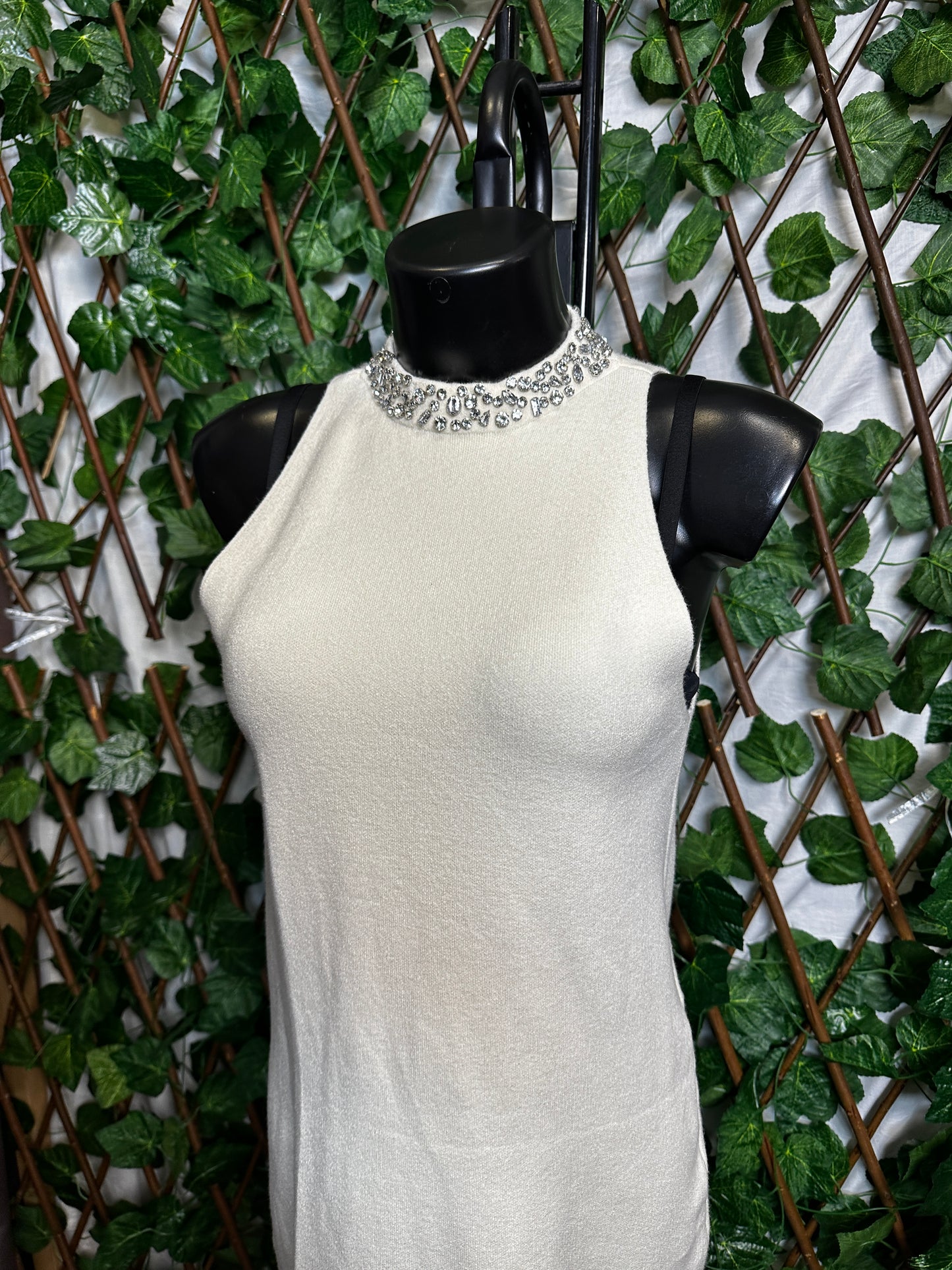 Maglione lungo senza maniche con collo brillantinato