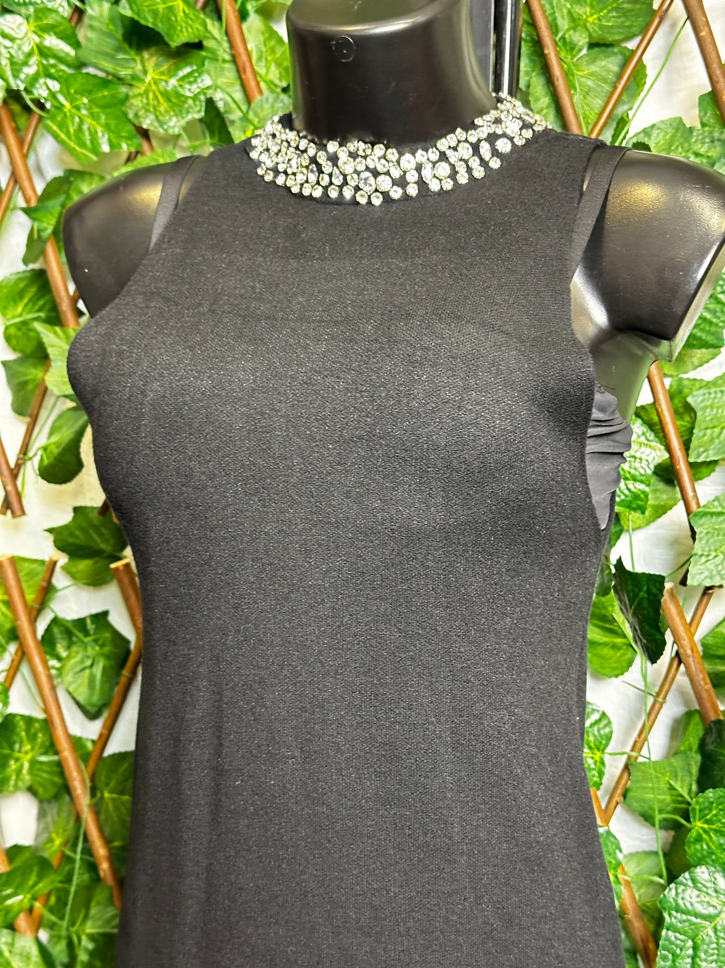 Maglione lungo senza maniche con collo brillantinato