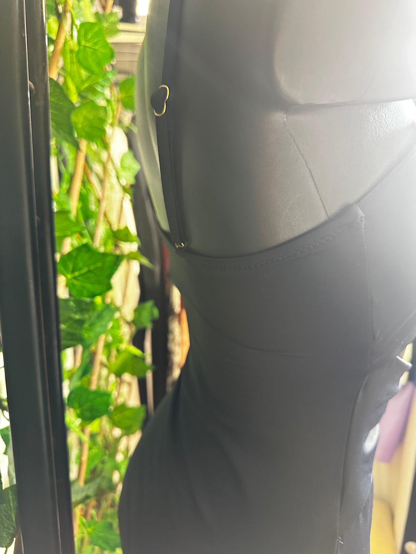 One-piece swimsuit with golden circle detail