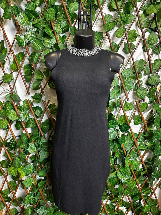 Maglione lungo senza maniche con collo brillantinato