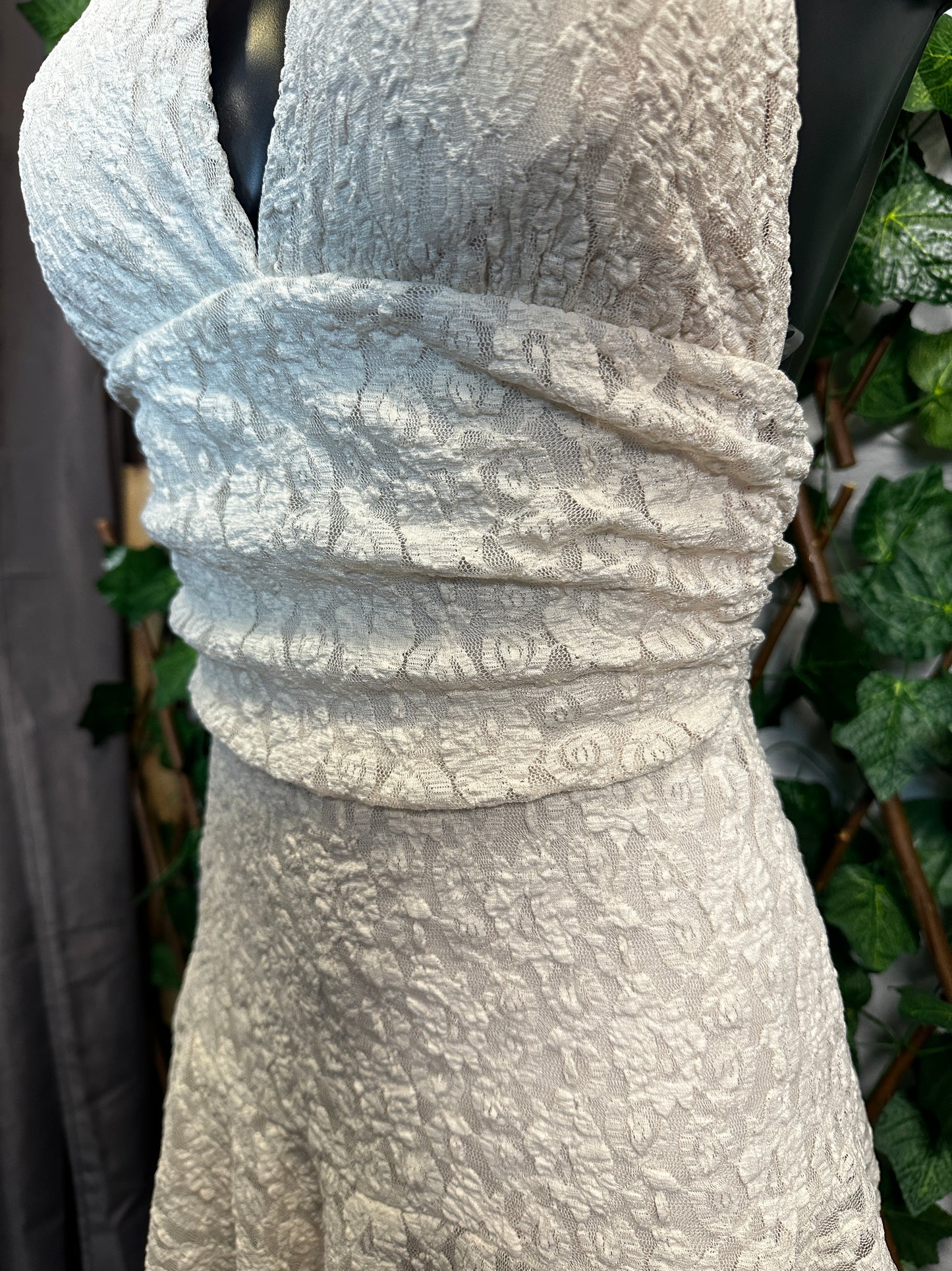 Crepe style: deep neckline with cups and open back, with shorts tucked in | one size