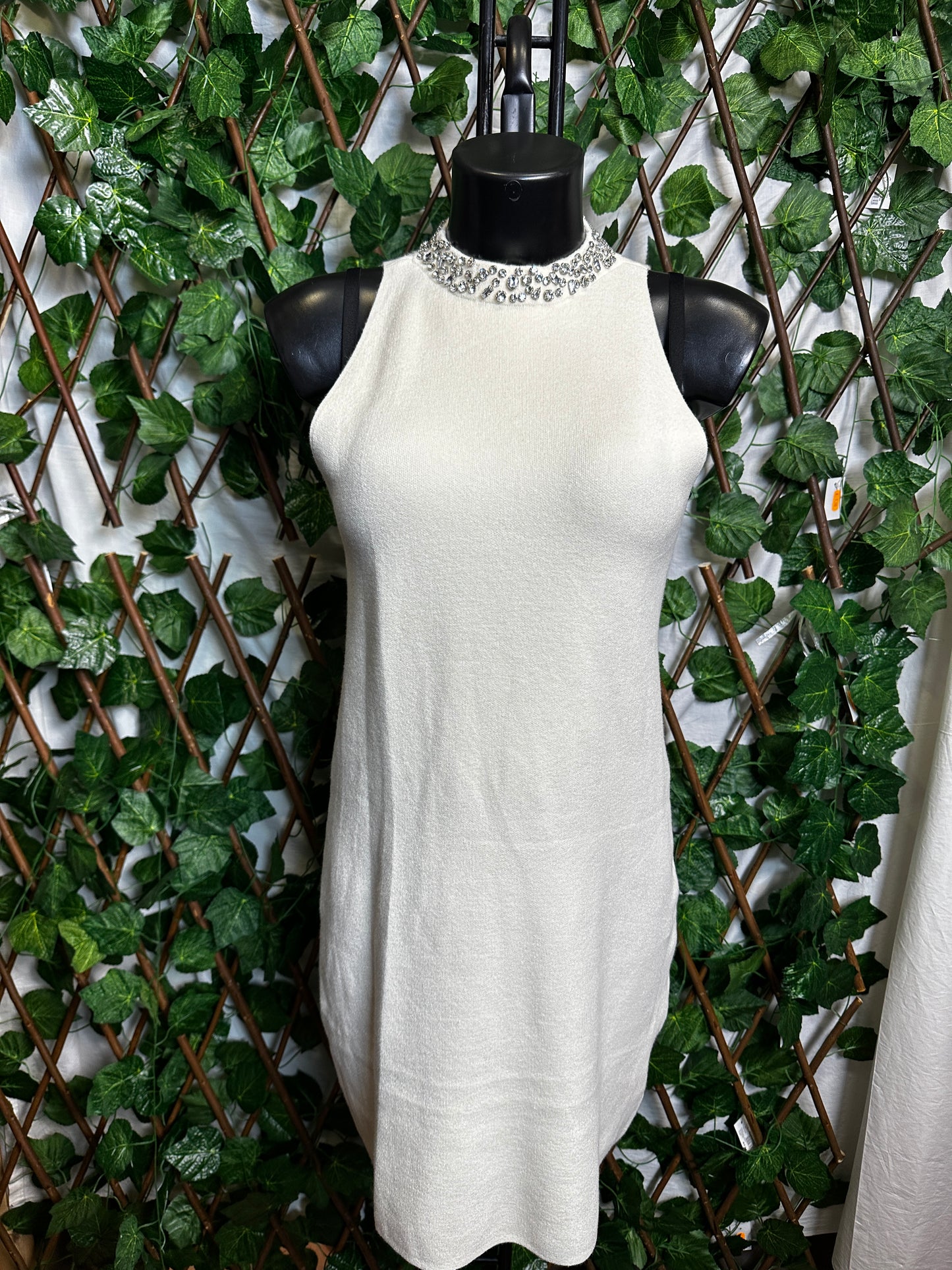 Maglione lungo senza maniche con collo brillantinato